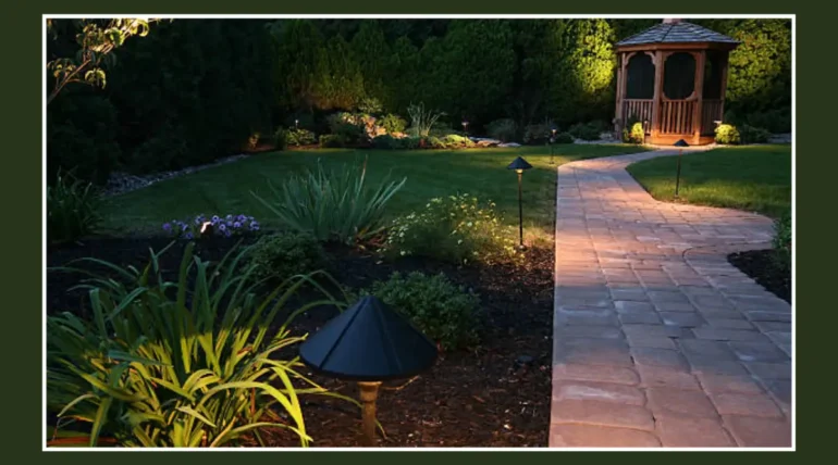 Custom landscape design in Austin TX featuring a stone walkway, lush greenery, and landscape lighting, highlighting sustainable and aesthetic yard features.